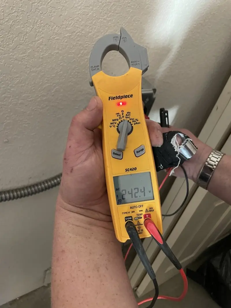 Voltage testing with clamp meter during Generator Installation in Paradise
